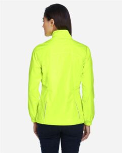 CORE365 78183 Women’s Techno Lite Motivate Unlined Lightweight Jacket – Safety Yellow (on model back)