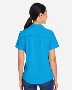 CORE365 CE510W Women’s Ultra UVP® Marina Shirt – Electric Blue (on model back)