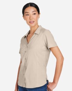 CORE365 CE510W Women’s Ultra UVP® Marina Shirt – Stone (on model side)