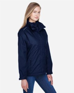 CORE365 78205 Women’s 3-in-1 Jacket with Fleece Liner – Classic Navy (on model side)