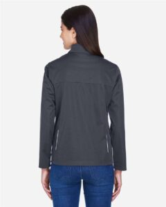 CORE365 CE708W Women’s Techno Lite Three-Layer Knit Tech-Shell – Carbon (on model back)