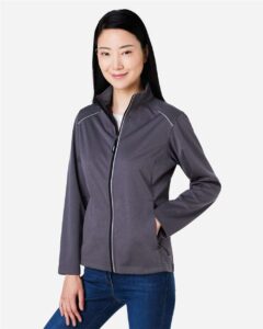 CORE365 CE708W Women’s Techno Lite Three-Layer Knit Tech-Shell – Carbon Heather (on model side)