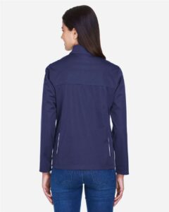 CORE365 CE708W Women’s Techno Lite Three-Layer Knit Tech-Shell – Classic Navy (on model back)