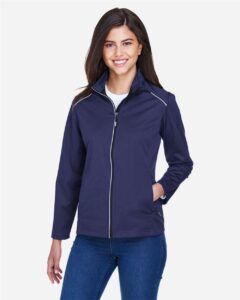 CORE365 CE708W Women’s Techno Lite Three-Layer Knit Tech-Shell – Classic Navy (on model)