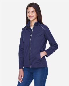 CORE365 CE708W Women’s Techno Lite Three-Layer Knit Tech-Shell – Classic Navy (on model side)
