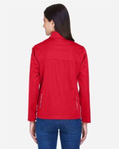 CORE365 CE708W Women’s Techno Lite Three-Layer Knit Tech-Shell – Classic Red (on model back)