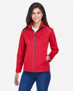 CORE365 CE708W Women’s Techno Lite Three-Layer Knit Tech-Shell – Classic Red (on model)