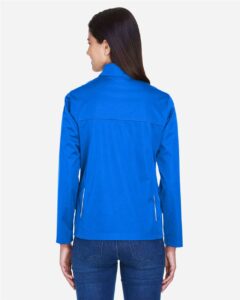 CORE365 CE708W Women’s Techno Lite Three-Layer Knit Tech-Shell – True Royal (on model back)