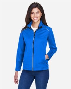 CORE365 CE708W Women’s Techno Lite Three-Layer Knit Tech-Shell – True Royal (on model)