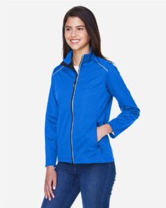 CORE365 CE708W Women’s Techno Lite Three-Layer Knit Tech-Shell – True Royal (on model side)