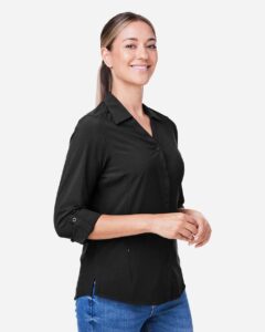 CORE365 CE510LW Women’s Ultra UVP® Marina Shirt – Black (on model side)