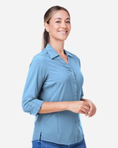 CORE365 CE510LW Women’s Ultra UVP® Marina Shirt – Columbia Blue (on model side)