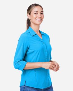 CORE365 CE510LW Women’s Ultra UVP® Marina Shirt – Electric Blue (on model side)
