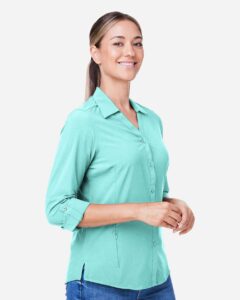 CORE365 CE510LW Women’s Ultra UVP® Marina Shirt – Sea Glass (on model side)