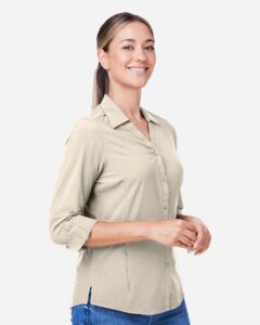 CORE365 CE510LW Women’s Ultra UVP® Marina Shirt – Stone (on model side)