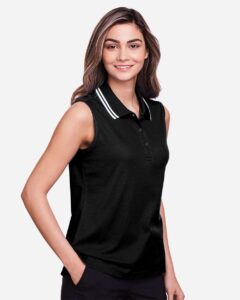 Devon & Jones DG20SW Women’s CrownLux Performance® Plaited Tipped Sleeveless Polo – Black/ White (on model side)