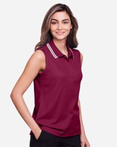 Devon & Jones DG20SW Women’s CrownLux Performance® Plaited Tipped Sleeveless Polo – Burgundy/ White (on model side)
