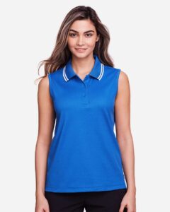 Devon & Jones DG20SW Women’s CrownLux Performance® Plaited Tipped Sleeveless Polo – French Blue/ White (on model)