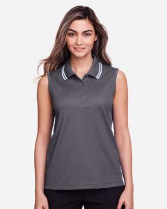 Devon & Jones DG20SW Women’s CrownLux Performance® Plaited Tipped Sleeveless Polo – Graphite/ White (on model)