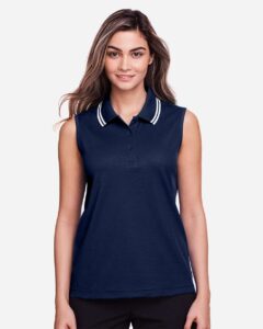 Devon & Jones DG20SW Women’s CrownLux Performance® Plaited Tipped Sleeveless Polo – Navy/ White (on model)