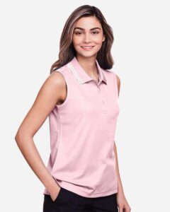 Devon & Jones DG20SW Women’s CrownLux Performance® Plaited Tipped Sleeveless Polo – Pink/ White (on model side)