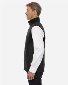 CORE365 88191T Men’s Tall Journey Fleece Vest – Black (on model side)