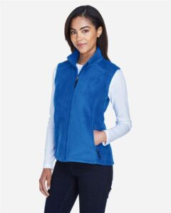 CORE365 78191 Women’s Journey Fleece Vest – True Royal (on model side)