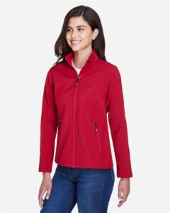 CORE365 78184 Women’s Cruise Two-Layer Fleece Bonded Soft Shell Jacket – Classic Red (on model side)