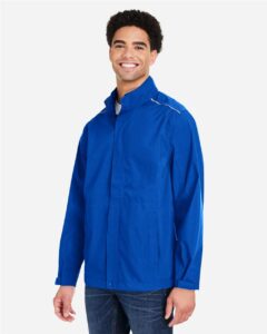 CORE365 CE712 Men’s Barrier Packable Rain Jacket – True Royal (on model side)