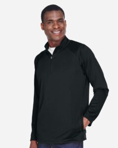 Devon & Jones DG440 Men’s Stretch Tech-Shell® Compass Quarter-Zip Pullover – Black (on model side)