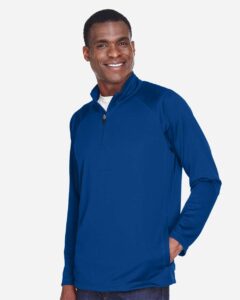 Devon & Jones DG440 Men’s Stretch Tech-Shell® Compass Quarter-Zip Pullover – True Royal (on model side)