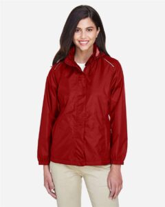 CORE365 78185 Women’s Climate Seam-Sealed Lightweight Variegated Ripstop Jacket – Classic Red (on model)