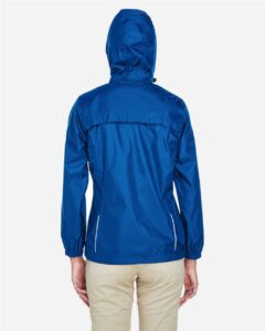 CORE365 78185 Women’s Climate Seam-Sealed Lightweight Variegated Ripstop Jacket – True Royal (on model back)