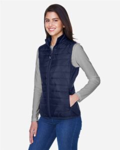 CORE365 CE702W Women’s Prevail Packable Puffer Vest – Classic Navy (on model side)