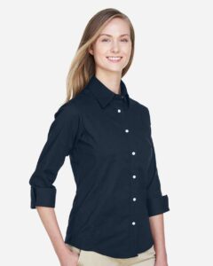 Devon & Jones DP625W Women’s Perfect Fit™ Three-Quarter Sleeve Stretch Poplin Dress Shirt – Navy (on model side)