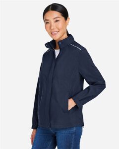 CORE365 CE712W Women’s Barrier Packable Rain Jacket – Classic Navy (on model side)