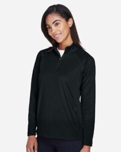 Devon & Jones DG440W Women’s Stretch Tech-Shell® Compass Quarter-Zip Pullover – Black (on model side)