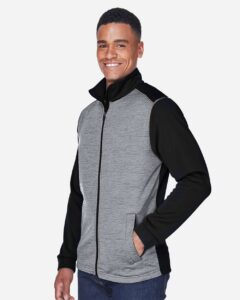 Devon & Jones DG796 Men’s Newbury Colorblock Mélange Fleece Full-Zip jacket – Black Heather/ Dark Grey Heather (on model side)