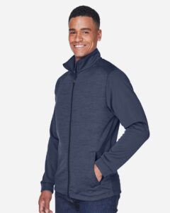 Devon & Jones DG796 Men’s Newbury Colorblock Mélange Fleece Full-Zip jacket – Navy/ Navy Heather (on model side)