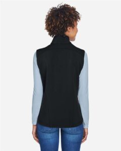CORE365 CE701W Women’s Cruise Two-Layer Fleece Bonded Soft Shell Vest – Black (on model back)