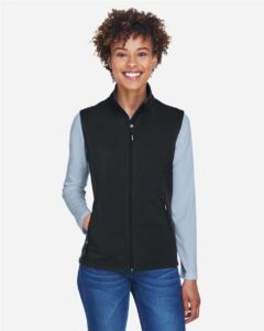 CORE365 CE701W Women’s Cruise Two-Layer Fleece Bonded Soft Shell Vest – Black (on model)