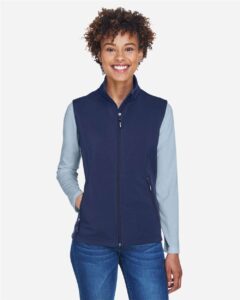CORE365 CE701W Women’s Cruise Two-Layer Fleece Bonded Soft Shell Vest – Classic Navy (on model)