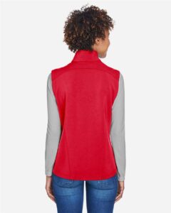 CORE365 CE701W Women’s Cruise Two-Layer Fleece Bonded Soft Shell Vest – Classic Red (on model back)