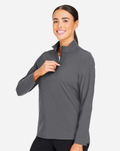 Devon & Jones DG410W Women’s CrownLux Performance® Windsor Welded Quarter-Zip Pullover – Graphite (on model side)