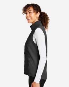 Devon & Jones DG706W Women’s New Classics® Charleston Hybrid Vest – Black/ Melange Black (on model side)