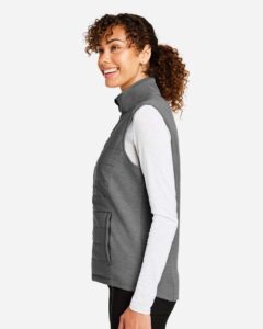 Devon & Jones DG706W Women’s New Classics® Charleston Hybrid Vest – Graphite Melange/ Graphite (on model side)