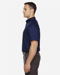CORE365 88194T Men’s Tall Optimum Short Sleeve Twill Dress Shirt – Classic Navy (on model side)