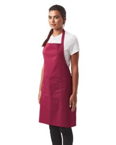 Artisan Collection by Reprime RP154 Recycled Pocket Bib Apron – Burgundy (on model side)