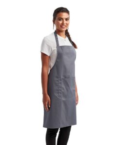 Artisan Collection by Reprime RP154 Recycled Pocket Bib Apron – Steel (on model side)