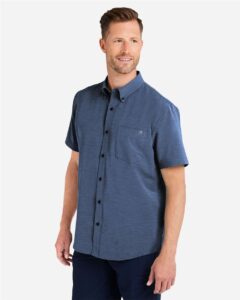 HUK H150154 Men’s Kona Short Sleeve Solid Shirt – Naval Academy (on model side)